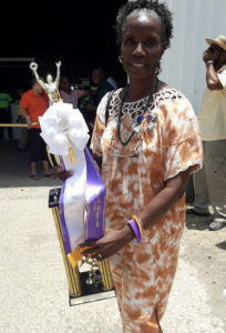 Linda Lacy Hodge holds her Farmer of the Year trophy Saturday at Agrifest. (Facebook photo) 