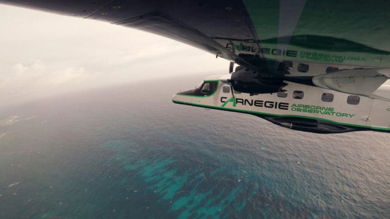 The 'Super Plane,' Carnegie Airborne Observatory, flies above Punta Cana, in the Dominican Republic. (Photo by Image by Marjo Aho/TNC)