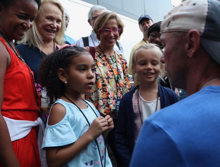 Milanya Provost and Elena Magnie sing their original song to Chesney. (Photo by William Stelzer)