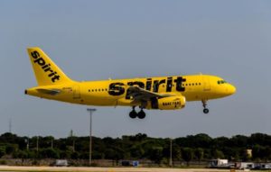 A Spirit Airlines jet flies over the tarmac. (Source file photo)