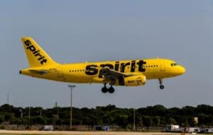 A Spirit Airlines jet flies over the tarmac. (Source file photo)