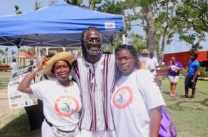 From left, Vivian St. Juste, Positive Nelson and Doris St. Juste relax in Frederiksted after the 2018 Freedom Walk. Nelson has organized the walk for years. (File photo)