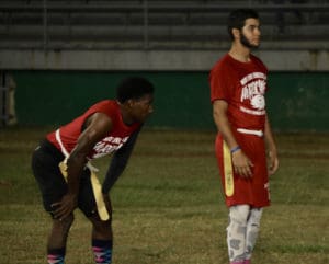 Canes running back Yohance Hanley, left, waits for the signal from quarterback Sebastian Silva and Saturday at Lionel Roberts Stadium. (James Gardner photo)