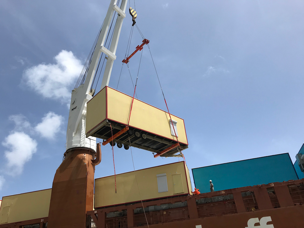 A modular classroom unit is lifted Sunday from the ship that transported it to St. Thomas. (Department of Education photo)