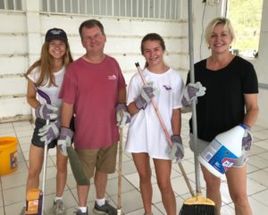 Dr. Mary Dobson Collier and her family, from Baton Rouge, Louisiana, help clean up and prepare youth camp at John Folly Learning Institute as volunteers coordinated through the St. John Culture & Heritage Foundation, Inc.