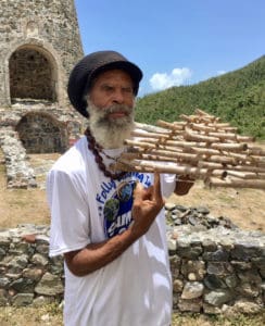 Delroy “ Ital” Anthony displays a kilivan used for trapping birds.