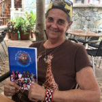 Christina Kessler holds her new book Tales of an Ikut Swami