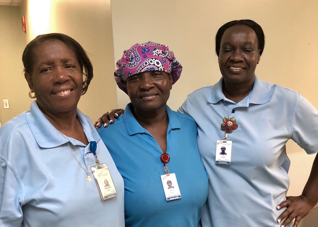 From left, JFL housekeeping staff members Ernestine Burke, Carol Felix and Tilda Rougier. The three were among 202 hospital employees targeted for $900 checks donation from from Greater New York Hospitals Association on Wednesday.