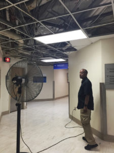 In August 2018, almost a year after the islands were battered by a pair of hurricanes, Schneider Hospital’s VP of Facilities Darryl Smalls stands inside the largely abandoned administrative area on the hospital’s second floor. (File photo)