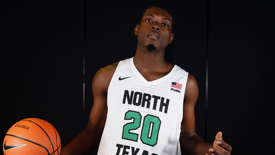 Shakeem Alcindor shows off his new uniform – of the University of North Texas. (Photo from Meangreensports.com)