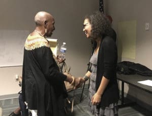 Tahirah Abubakr left, greets Tuesday Ryan-Hart, at the St. Croix Foundation meeting.