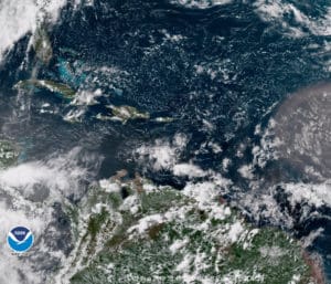 Satellite photo of the Caribbean at 12:45 p.m. AST shows a tropical wave nearing the islands. (NOAA photo)