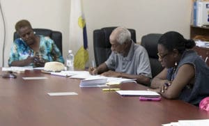 Board of Elections members work Monday to certify the August primary election results.