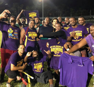 The Archers celebrate their win in the championship of the Mens Summer Flag Football League. (Photo by Francisco Jarvis)