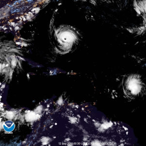 NOAA satellite photo taken at 8:30 p.m. Wednesday shows Tropical Storm Isaac, right, on the doorstep of the Antilles, while Hurricane Florence, a Category 4 storm, takes aim at the U.S. east coast.