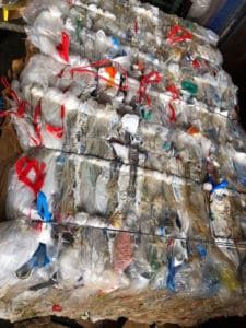 Bales of crushed plastic are waiting for be shipped to the mainland for recycling.