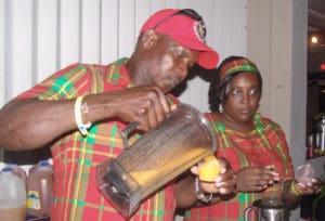 At the 2012 Taste of St. Croix, Percival Stang and Jessica Benjamin serve up smoothies from Country Snack Stand.