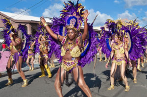 A dance troupe glitters in the sun during the 2015-2016 Crucian Christmas Festival Adult Parade. (Source file photo)