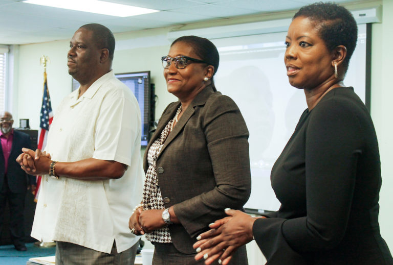 From left, Senators-elect Kenneth Gittens, Donna Frett Gregory and Alicia Barnes stand up to be introduced at Monday’s conference.