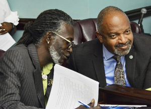 Sens. Positive T.A. Nelson, left, and Tregenza Roach, the sponsors of the medical cannabis bill, confer at Monday’s committee hearing.