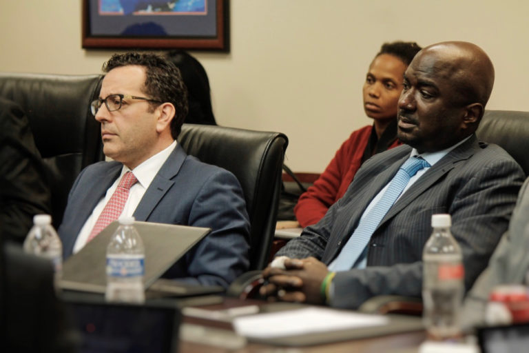 IGY CEO Tom Mukamal, left, and VP of Corporate Services Charles Irons testify before the EDC in December.
