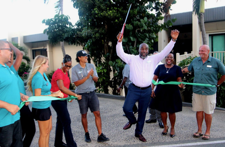 Larry Stokes cuts the ribbon to mark the completion of hurricane repair and renovation at Point Pleasant Resort.