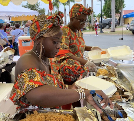 The ladies at the Goodies table serve hot dinners to delighted food fair attendees Wednesday in Frederiksted's Buddhoe Park.
