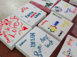 Small canvases painted by attendees of the Day of Service event.