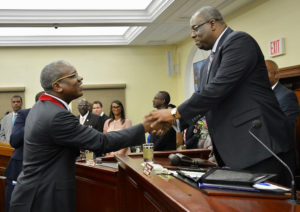 Gov. Albert Bryan Jr., left, shakes hands with Senate President Kenneth Gittens before delivering his first State of the Territory Address. (Photo by Barry Leerdam)
