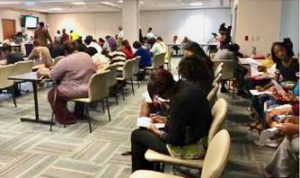 Job hopefuls fill out forms at the Juan F. Luis Memorial Hospital's Cardiac Care Center during JFL's Job Fair Friday. (Photo submitted by JFL)