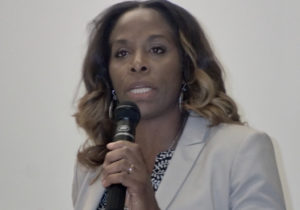 Stacey Plaskett addresses a town hall meeting Saturday at UVI on St. Croix.