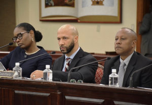 From left, JFL CEO Dyma Williams, Schneider Chief Medical Officer Luis Amaro, and Schneider VP of Facilities Darryl Smalls testify at Monday's hearing.