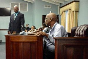 Former Senator-At-Large Robert O'Connor Jr. raises concerns about St. John while the current office holder, Steven Payne, listens. The discussion took place as part of a Town Hall meeting held Friday night in Cruz Bay.