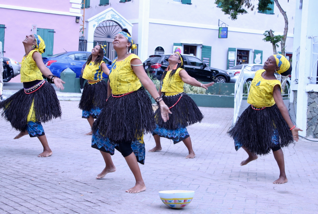 Earth Mama’s Pan African Dance Company perform while providing decorated bowls for attendees to leave donations instead of traditional money spraying, which is the act of sticking money to a performer’s forehead. (Bethaney Lee photo)