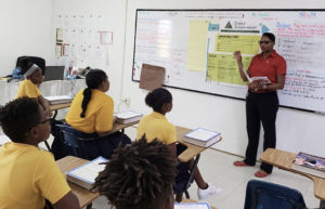 Shanice Wilson, a volunteers from Banco Popular, leads a Junior Achievement discussion at Elena Christian Junior High School on St. Croix. (Photo provided by Denelle G. Baptiste)
