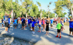 Before the race, competitors warm up with Dr. Brad Koepel. (Photo provided by Al LaBorde)