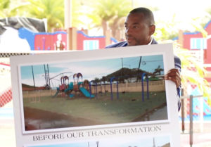 Sports, Parks and Recreation Commissioner-designee Calvert White shows what the playground looked like before its reconstruction.