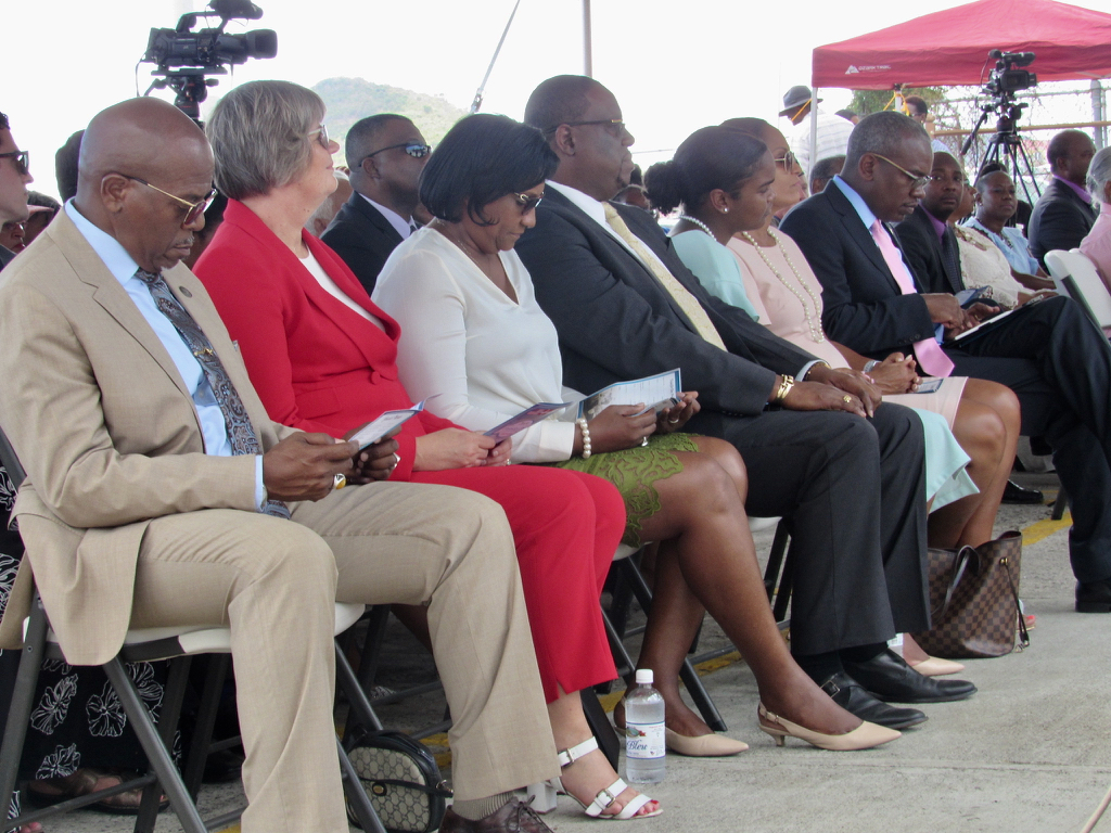 Dignitaries take the dais for Transfer Day observance on St Thomas.