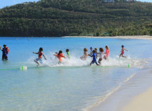 Eager contestants throw themselves into the water for the first leg of the triathlon, the swimming leg. (Photo provided by Al LaBorde)