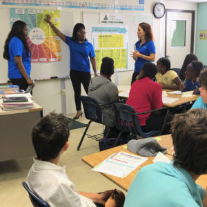 Volunteers Sherry-Ann Francis, Shena Esannason, and Alice Krall talk to Gift Hill School students about careers. (Amy Roberts photo)