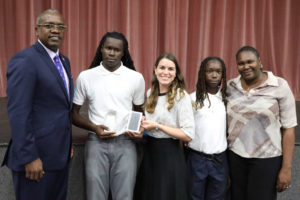 From left, Gov. Albert Bryan poses for a photo with Saeed Phillips, AT&T representative Alexandria Veridailes, Phillips' brother Khaled Heywood and his mother Estica Ceasar. (Government House photo)