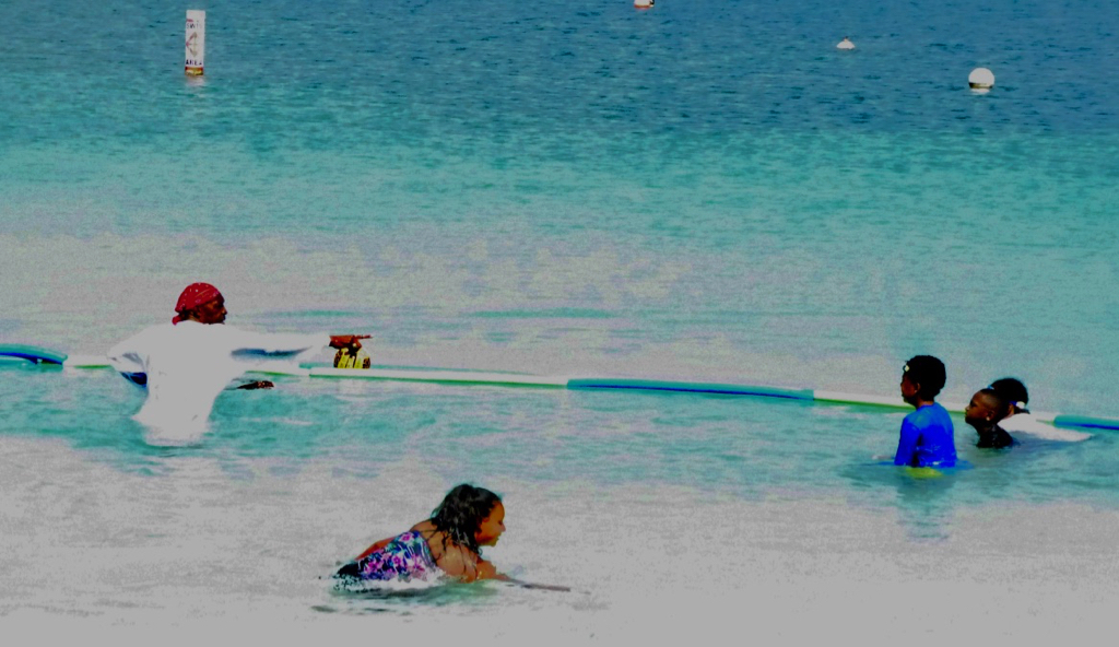 Vincent Henley, left, and swimmers at Magens Bay (sap photo)