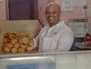 Ignacio Nunez, owner of Nachos Deli, displays some of his baked goods.