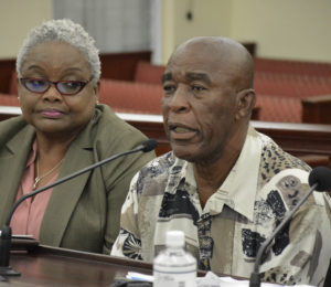 Taxi owner James Penn testifies against a bill that would require taxicab owners to accept payment by credit cards from customers during the Government Operations, Consumers and Affairs Committee’s Monday meeting. To his left is Averyl Fabian of the Bureau of Internal Revenue. (Photo by Barry Leerdam for the V.I. Legislature)