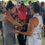 Marina Falcone, first-place winner of the unassisted long course, receives award from Tonia Lovejoy