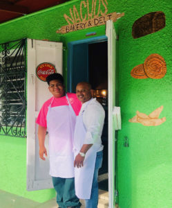 Nachos Bakery owner Ignacio Nunez and son, Jose, at the entrance to Nachos Bakery and Deli.