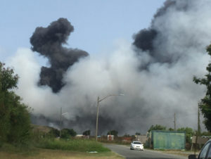 Smoke billows on Sunday afternoon from a fire at the Anguilla Landfill, adjacent to the Henry E. Rohlsen Airport on St. Croix. (Source photo by Susan Ellis)