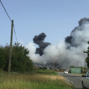 Smoke billows on Sunday afternoon from a fire at the Anguilla Landfill, adjacent to the Henry E. Rohlsen Airport on St. Croix. (Source photo by Susan Ellis)