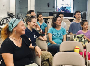 The audience smiles during the citizen science lecture. (Elisa McKay photo)