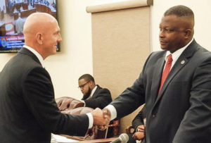 VITEMA Director Daryl Jaschen, left, shakes hands with Sen. Athneil Thomas after his senate confirmation Tuesday. (Photo by Barry Leerdam for the V.I. Legislature)